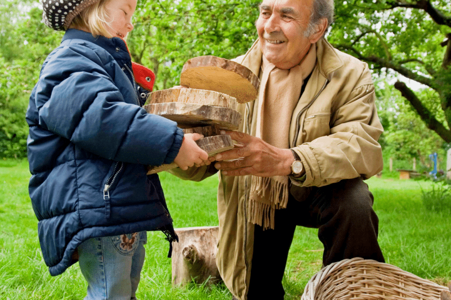 Petite fille aidant son grand père avec le bois de chauffage